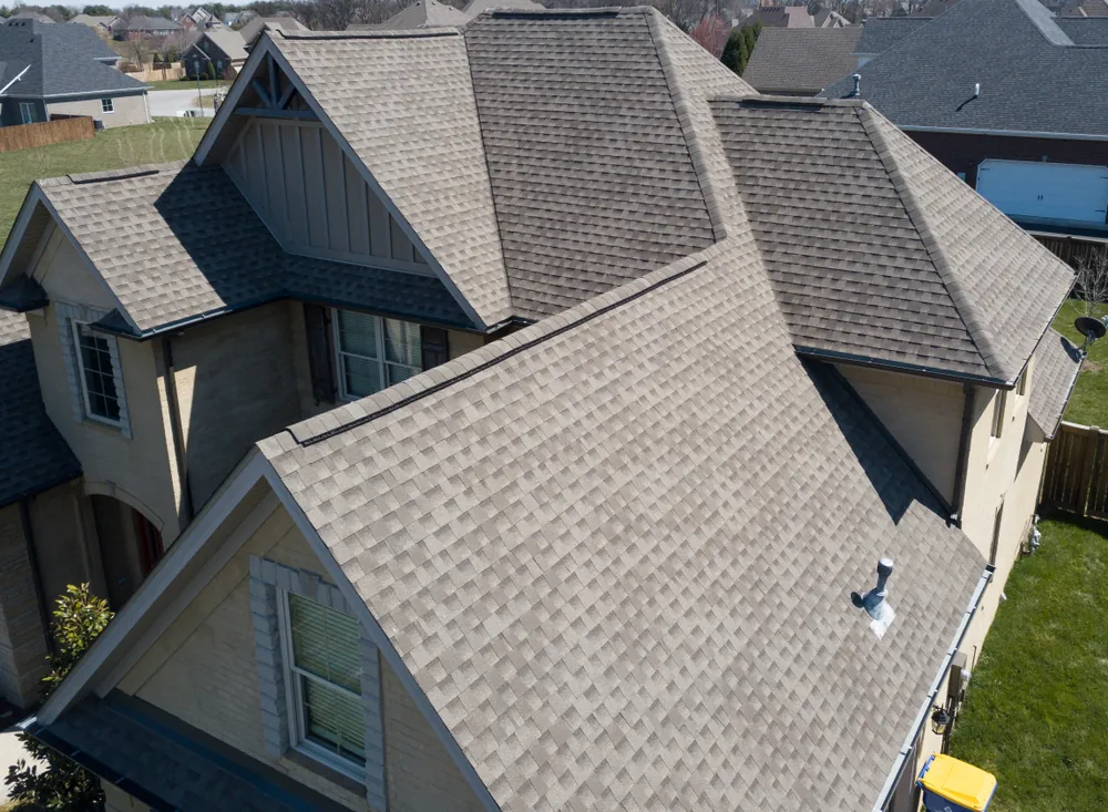 Aerial view of an architectural shingle roof with multiple hips and valleys